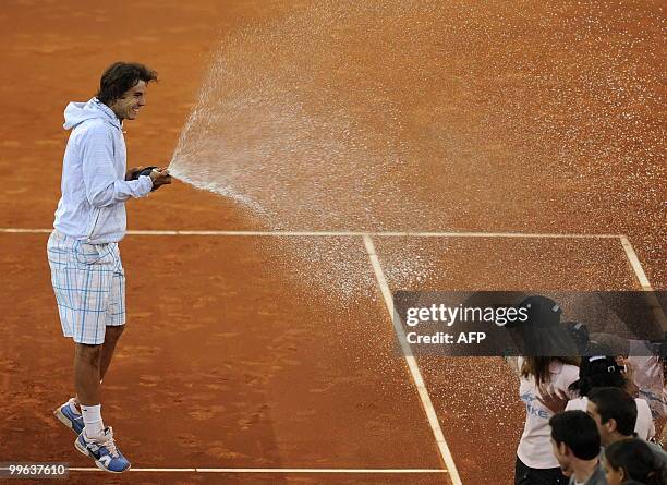 Spain's Rafael Nadal celebrates winning against Roger Federer after their final match of the Madrid Masters on May 16, 2010 at the Caja Magic sports...