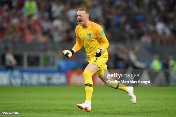 Jordan Pickford of England celebrates the opening goal scored by Kieran Trippier during the 2018 FIFA World Cup Russia Semi Final match between...