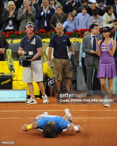 Spain's Rafael Nadal celebrates winning against Roger Federer after their final match of the Madrid Masters on May 16, 2010 at the Caja Magic sports...