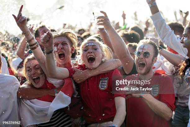 England football fans celebrate England's first goal during a Hyde Park screening of the FIFA 2018 World Cup semi-final match between Croatia and...