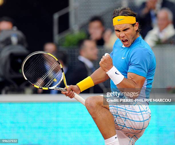 Spain's Rafael Nadal celebrates winning a point Roger Federer during their final match of the Madrid Masters on May 16, 2010 at the Caja Magic sports...