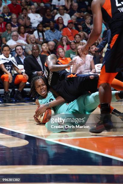 Epiphanny Prince of the New York Liberty grabs a loose ball against the Connecticut Sun on July 11, 2018 at the Mohegan Sun Arena in Uncasville,...