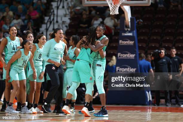 Shavonte Zellous hugs Tina Charles of the New York Liberty after hitting the game winning shot against the Connecticut Sun on July 11, 2018 at the...