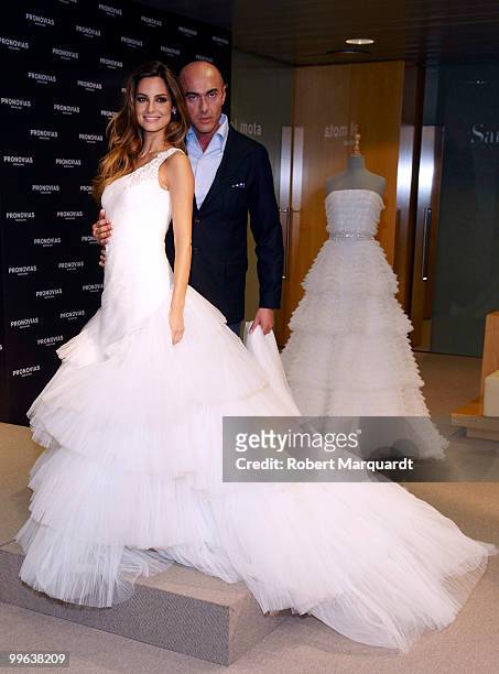 Model Ariadne Artiles and creative director Manuel Mota present the latest collection for Pronovias 2011 on May 17, 2010 in Barcelona, Spain.