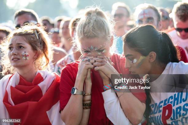England football fans look on during a Hyde Park screening of the FIFA 2018 World Cup semi-final match between Croatia and England on July 11, 2018...
