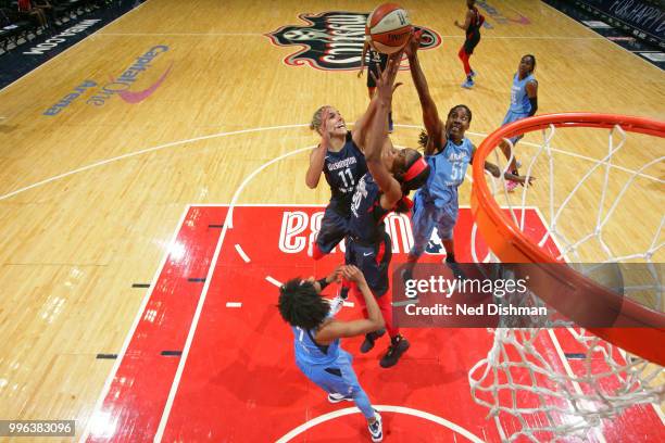 Elena Delle Donne and LaToya Sanders of the Washington Mystics go up for a rebound against Jessica Breland of the Atlanta Dream on July 11, 2018 at...