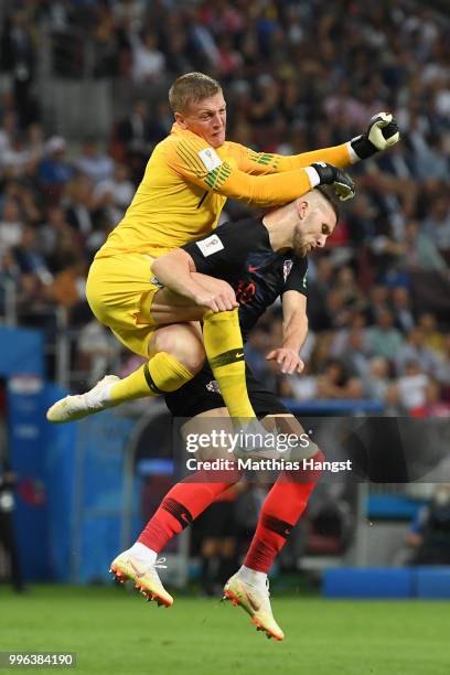 Jordan Pickford of England collides with Ante Rebic of Croatia during the 2018 FIFA World Cup Russia Semi Final match between England and Croatia at...