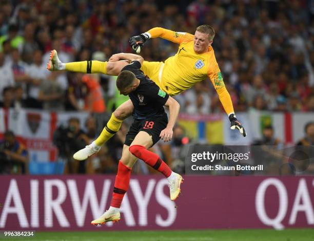 Jordan Pickford of England collides with Ante Rebic of Croatia during the 2018 FIFA World Cup Russia Semi Final match between England and Croatia at...