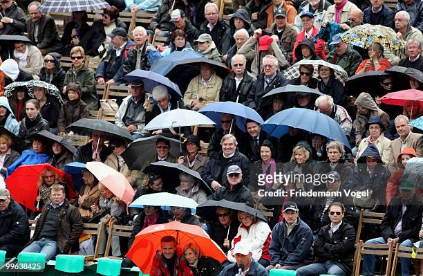 Fans in the rain during the double Philip Kohlschreiber and Christopher Kas of Germany against Jeremy Chardy and Nicolas Mahut of France during the...