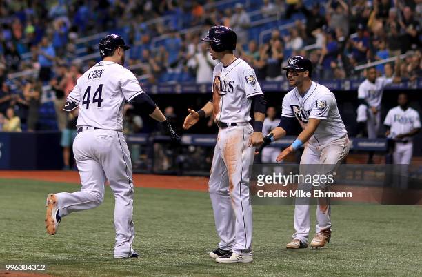 Cron of the Tampa Bay Rays is congratulated after hitting a three run home run in the seventh inning during a game against the Detroit Tigers at...