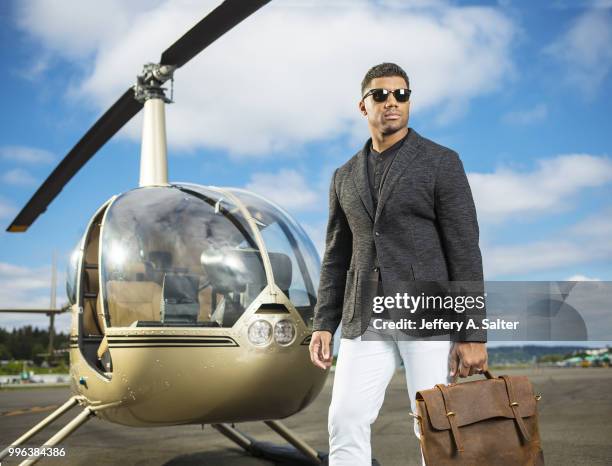 Fashionable 50: Portrait of Seattle Seahawks QB Russell Wilson posing during photo shoot at Clay Lacy Aviation. Seattle, WA 5/16/2018 CREDIT: Jeffery...