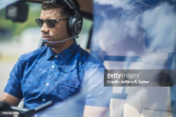 Fashionable 50: Closeup portrait of Seattle Seahawks QB Russell Wilson seated in helicopter during photo shoot at Clay Lacy Aviation. Seattle, WA...