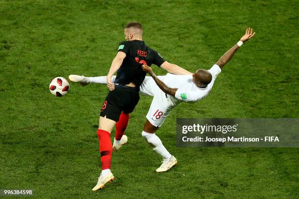 Ashley Young of England tackles Ante Rebic of Croatia during the 2018 FIFA World Cup Russia Semi Final match between England and Croatia at Luzhniki...