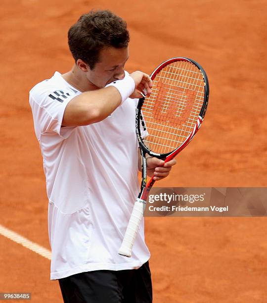Philip Kohlschreiber of Germany looks dejected during his double match against Jeremy Chardy and Nicolas Mahut of France during the second day of the...
