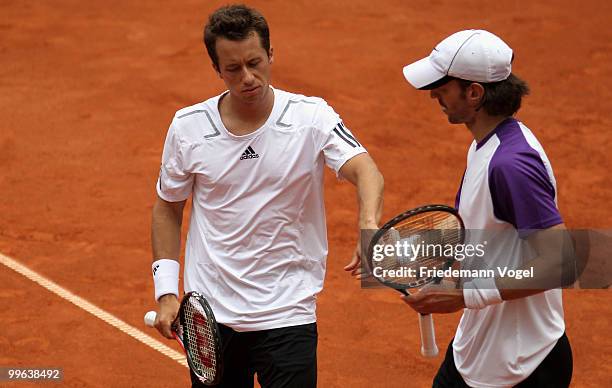 Philip Kohlschreiber and Christopher Kas of Germany look dejected during their double match against Jeremy Chardy and Nicolas Mahut of France during...