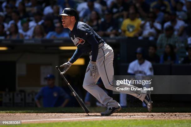 Freddie Freeman of the Atlanta Braves hits a single in the third inning against the Milwaukee Brewers at Miller Park on July 8, 2018 in Milwaukee,...