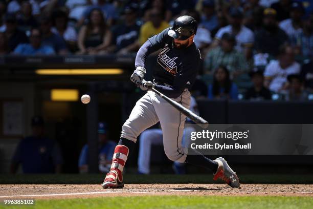 Nick Markakis of the Atlanta Braves flies out in the third inning against the Milwaukee Brewers at Miller Park on July 8, 2018 in Milwaukee,...