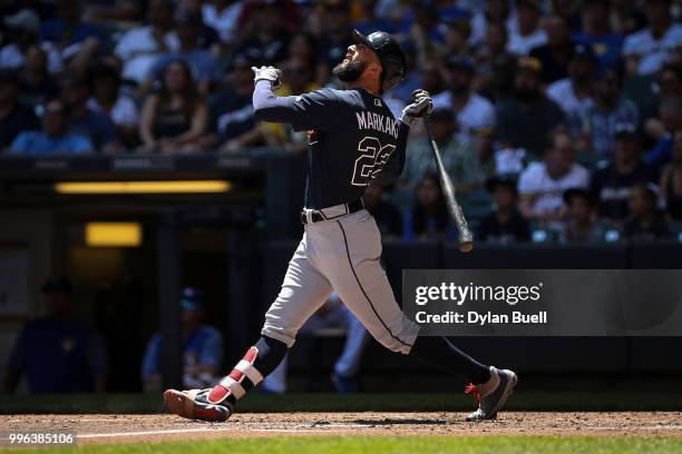 Nick Markakis of the Atlanta Braves flies out in the third inning against the Milwaukee Brewers at Miller Park on July 8, 2018 in Milwaukee,...