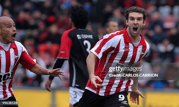 Mauro Boselli of Estudiantes celebrates a goal against Colon with teammate Clemente Rodriguez during their Argentinian tournament football match in...