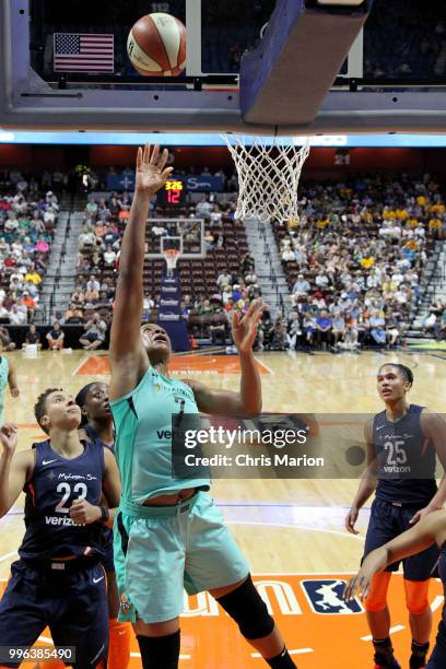 Kia Vaughn of the New York Liberty goes to the basket against the Connecticut Sun on July 11, 2018 at the Mohegan Sun Arena in Uncasville,...