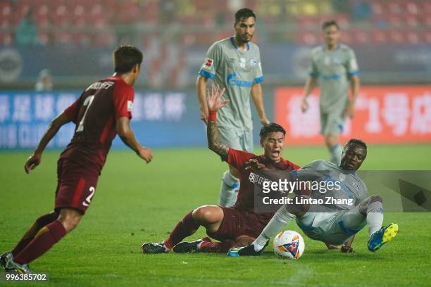 Bernard Tekpetey of Schalke in action with Ren Hang of China Fortune during the 2018 Clubs Super Cup match between FC Schalke 04 and China Fortune at...