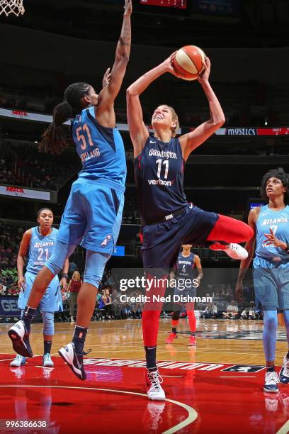 Elena Delle Donne of the Washington Mystics drives to the basket and shoots the ball against the Atlanta Dream on July 11, 2018 at Capital One Arena...