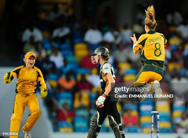 Australian bowler Ellyse Perry celebrates with Alyssa Healy the dismissal of New Zealand player Amy Satterthwaite during the Women's ICC World...