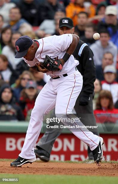 Adrian Beltre of the Boston Red Sox can't handle this ground ball during the game between the Toronto Blue Jays and the Boston Red Sox on Wednesday,...