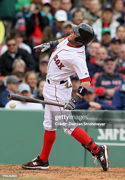 Dustin Pedroia of the Boston Red Sox is hit by a pitch during the game between the Toronto Blue Jays and the Boston Red Sox on Wednesday, May 12 at...