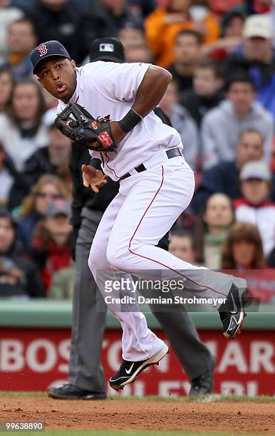 Adrian Beltre of the Boston Red Sox can't handle this ground ball during the game between the Toronto Blue Jays and the Boston Red Sox on Wednesday,...