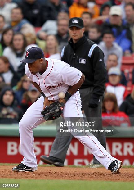 Adrian Beltre of the Boston Red Sox can't control this ground ball during the game between the Toronto Blue Jays and the Boston Red Sox on Wednesday,...