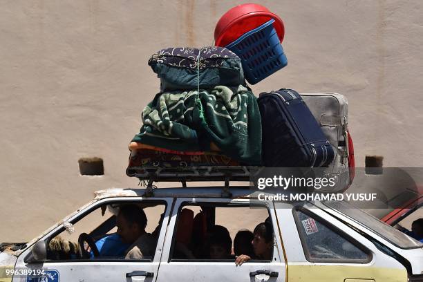 Displaced Syrians from the Daraa province come back to their hometown in Bosra, southwestern Syria, on July 11, 2018. - Syria's southern province of...