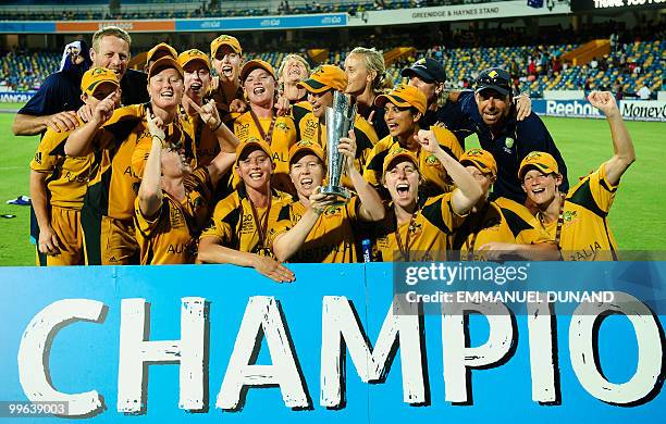 Australian captain Alex Blackwell and players celebrate on the winners' podium after winning the Women's ICC World Twenty20 final match between...