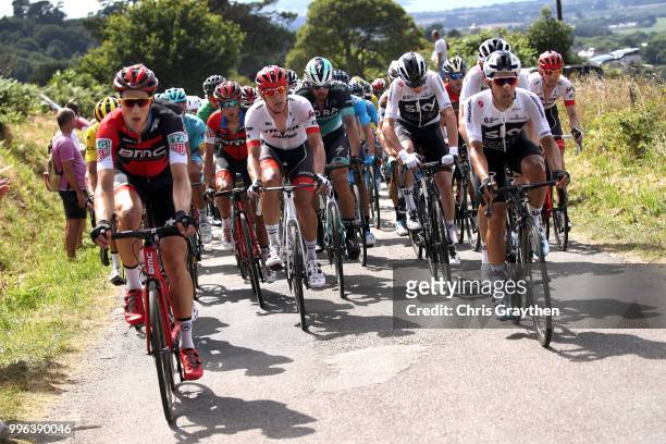 Jasper Stuyven of Belgium and Team Trek Segafredo / Christopher Froome of Great Britain and Team Sky rides in the peloton during stage five of the...
