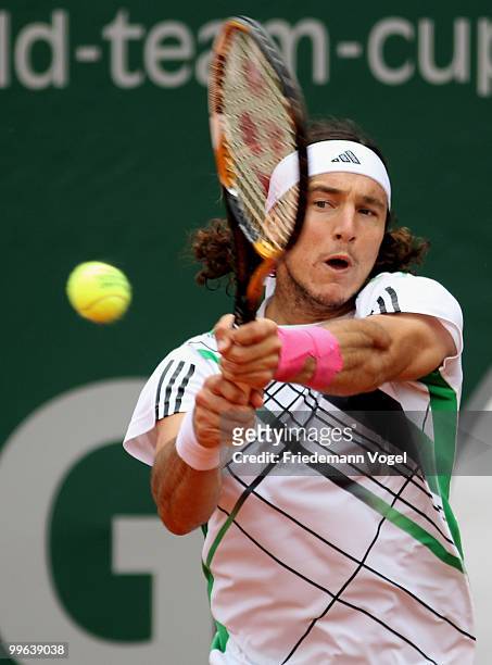 Juan Monaco of Argentina in action during his match against Victor Troicki of Serbia during the second day of the ARAG World Team Cup at the...