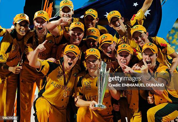 Australian captain Alex Blackwell and players celebrate on the winners' podium after winning the Women's ICC World Twenty20 final match between...