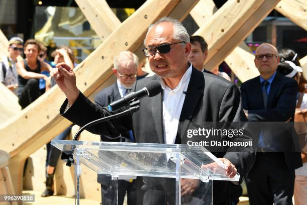 Artist Mel Chin speaks during the unveiling of his large-scale sculpture "Wake" and companion mixed reality piece "Unmoored" in Times Square on July...