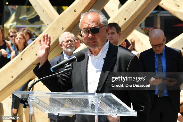 Artist Mel Chin speaks during the unveiling of his large-scale sculpture "Wake" and companion mixed reality piece "Unmoored" in Times Square on July...