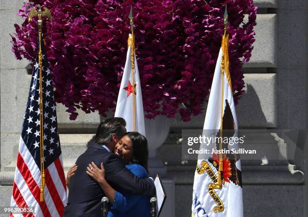 California Lt. Gov. Gavin Newsom hugs San Francisco mayor London Breed during her inauguration at San Francisco City Hall on July 11, 2018 in San...