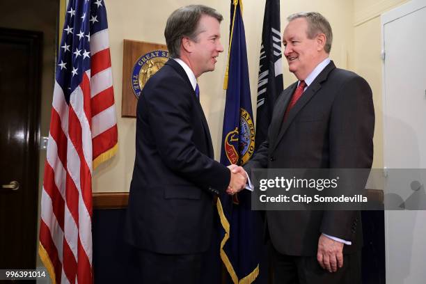 Judge Brett Kavanaugh shakes hands with Sen. Michael Crapo before a meeting in Crapo's offices in the Dirksen Senate Office Building on Capitol Hill...