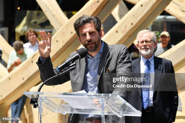 Times Square Alliance president Tim Tompkins speaks during the unveiling of artist Mel Chin's large-scale sculpture "Wake" and companion mixed...