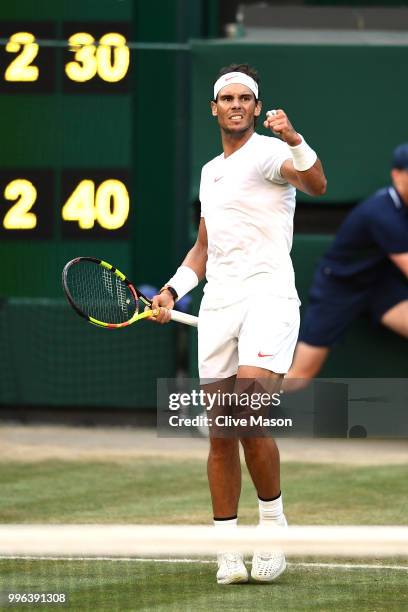 Rafael Nadal of Spain celebrates winning a point against Juan Martin Del Potro of Argentina during their Men's Singles Quarter-Finals match on day...