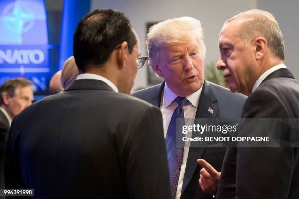 President Donald Trump speaks with Turkey President Recep Tayyip Erdogan during a working dinner at The Parc du Cinquantenaire - Jubelpark Park in...