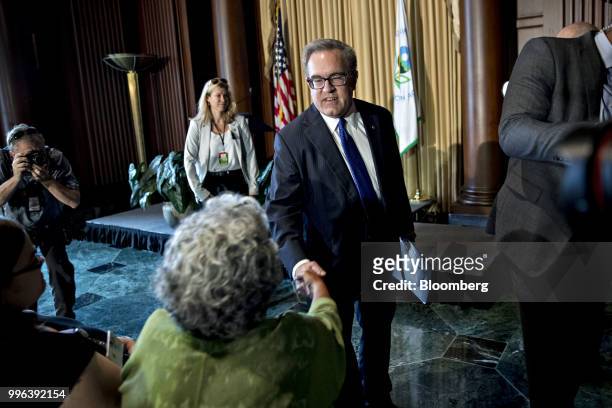 Andrew Wheeler, acting administrator of the Environmental Protection Agency , greets an employee after speaking at the agency's headquarters in...