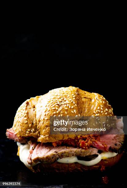 sandwich with roast beef and vegetables - roast beef sandwich stock pictures, royalty-free photos & images
