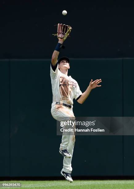 Max Kepler of the Minnesota Twins makes a catch in right field of the ball hit by Mike Moustakas of the Kansas City Royals during the fifth inning of...