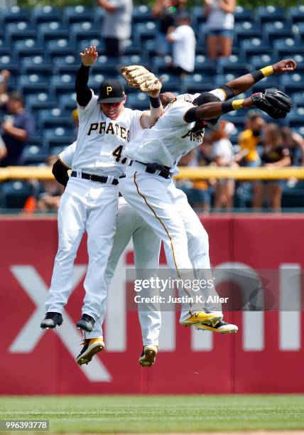 Jordan Luplow of the Pittsburgh Pirates, Gregory Polanco of the Pittsburgh Pirates and Starling Marte of the Pittsburgh Pirates celebrate after...