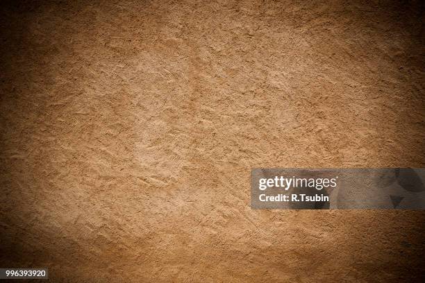 vintage brown painted plaster concrete wall background. dark edged - edged stock pictures, royalty-free photos & images