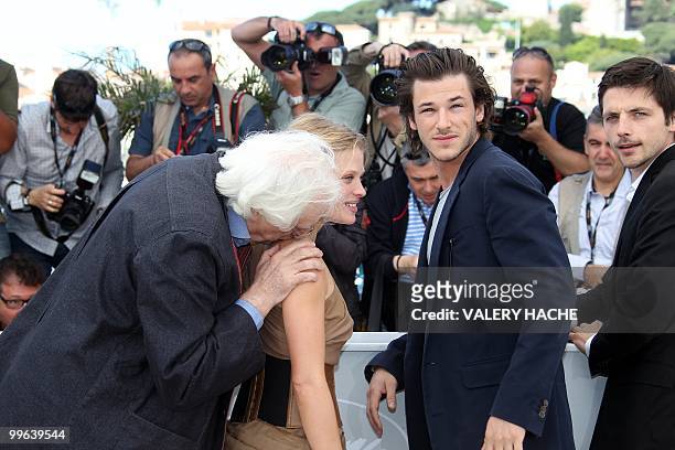 French director Bertrand Tavernier kisses the sholder of French actress Melanie Thierry as they pose with French actor Gaspard Ulliel and French...