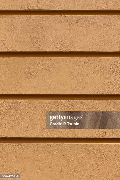 yellow painted plaster concrete wall background. dark edged - edged stock pictures, royalty-free photos & images